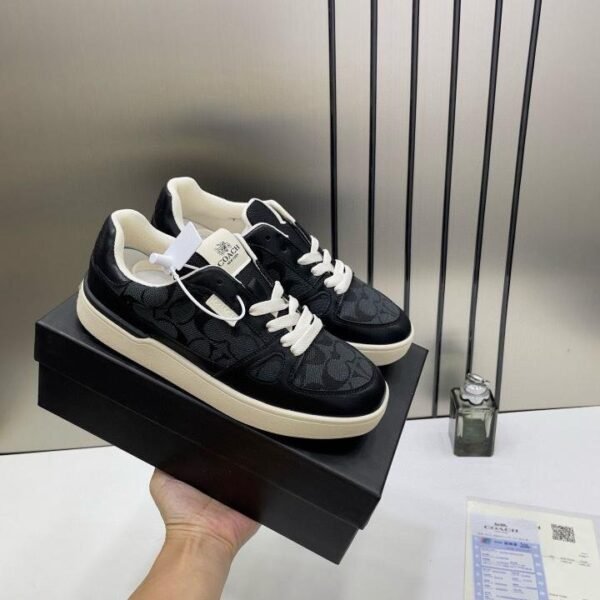 WMN Coaach Clip Court Sneaker in the black signature canvas and leather.